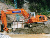 Hitachi UH801 excavating tailrace excavation adjacent 2nd tunnel portal